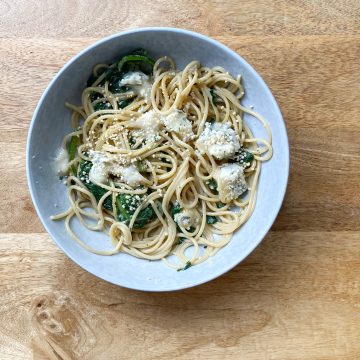 Plate of spaghetti with greens
