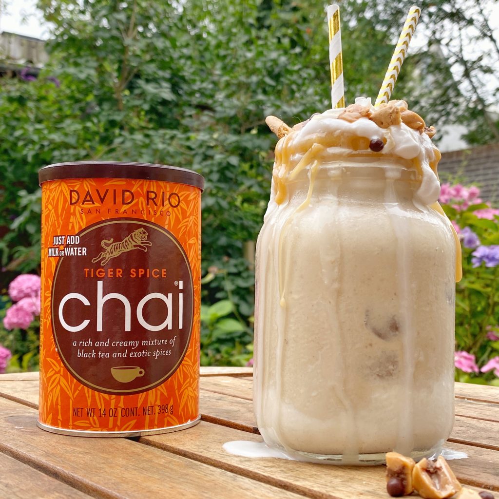 Milkshake with toppings and a can of David Rio chai mix