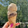 Scoop of coffee ice cream on chocolate cone